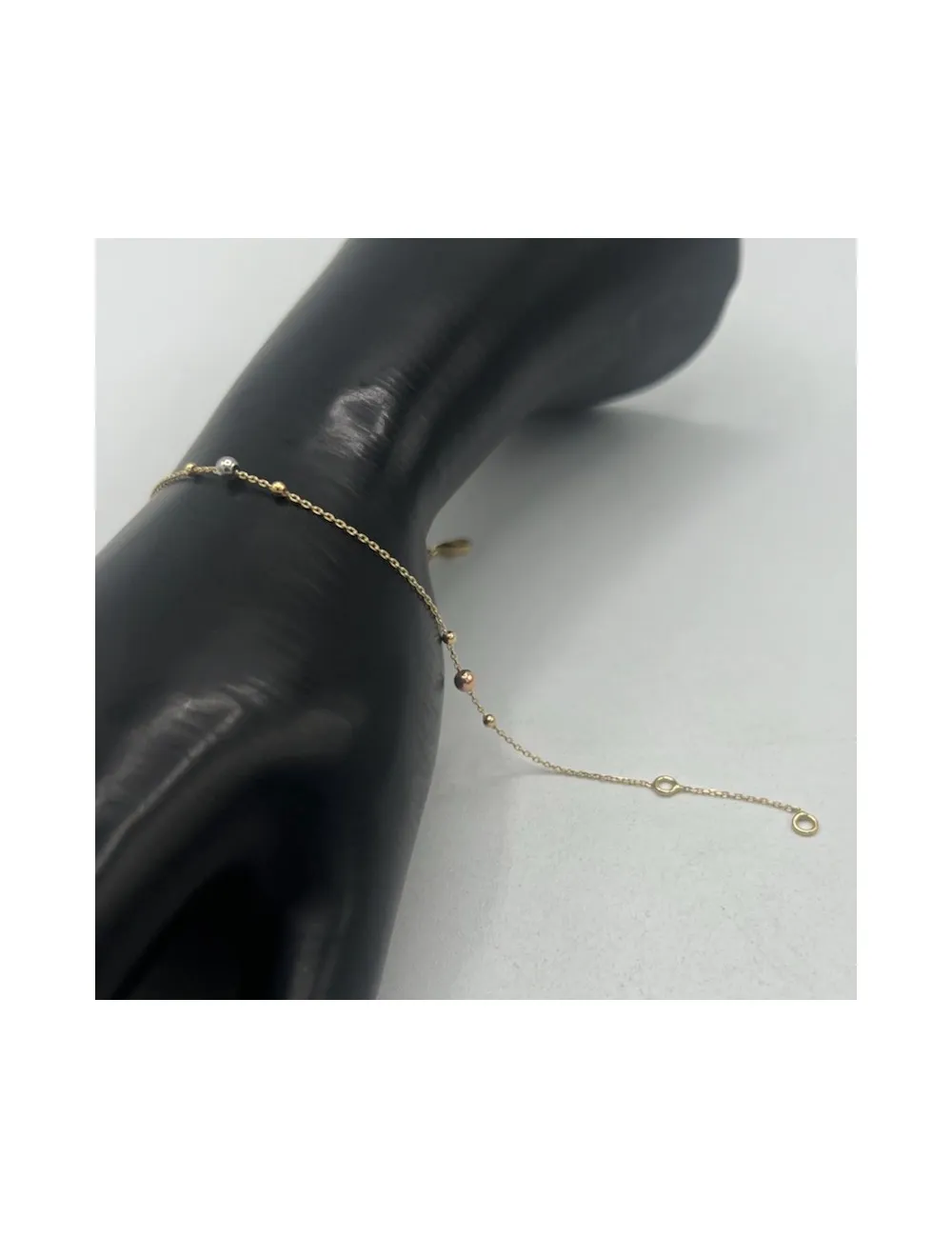 Bracciale e catenina in oro giallo con palline